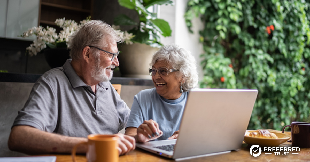 Business owner looking out window with an open sign in the window