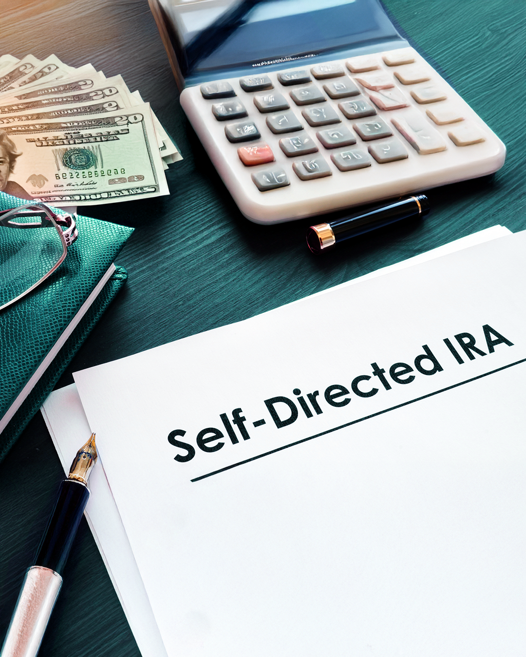 Paper with Self Directed IRA printed on it.